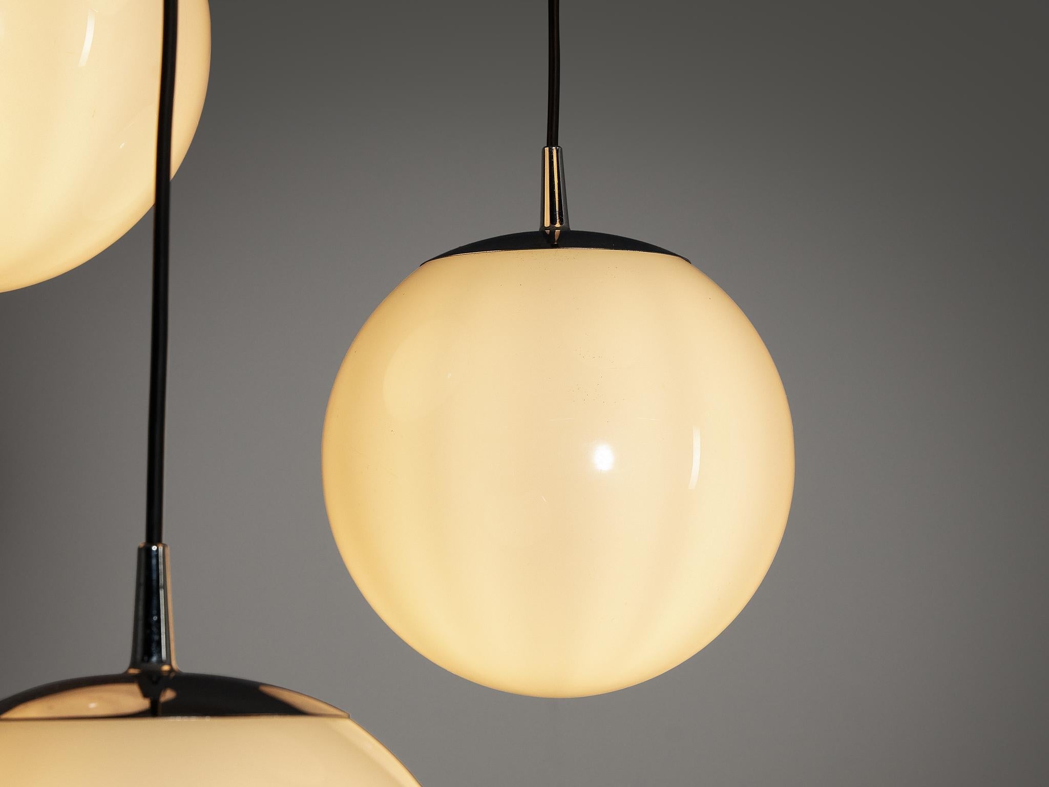 Mid-Century Modern Set of Four Pendants with White Glass Spheres