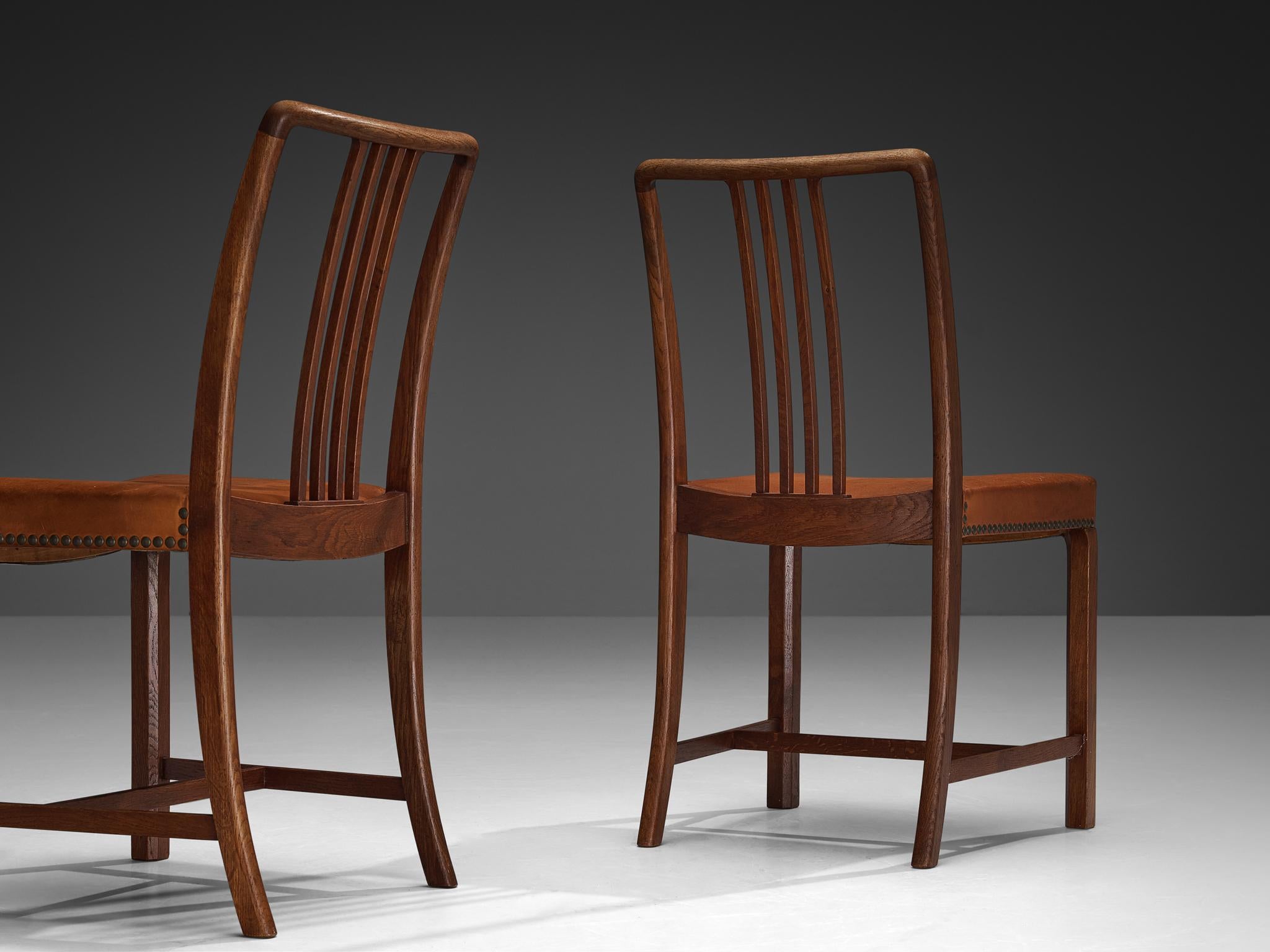 Jørgen Christensens Set of Eight Dining Chairs in Cognac Leather and Oak