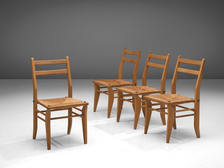 Guillerme & Chambron Set of Four Dining Chairs in Oak with Rush Seats