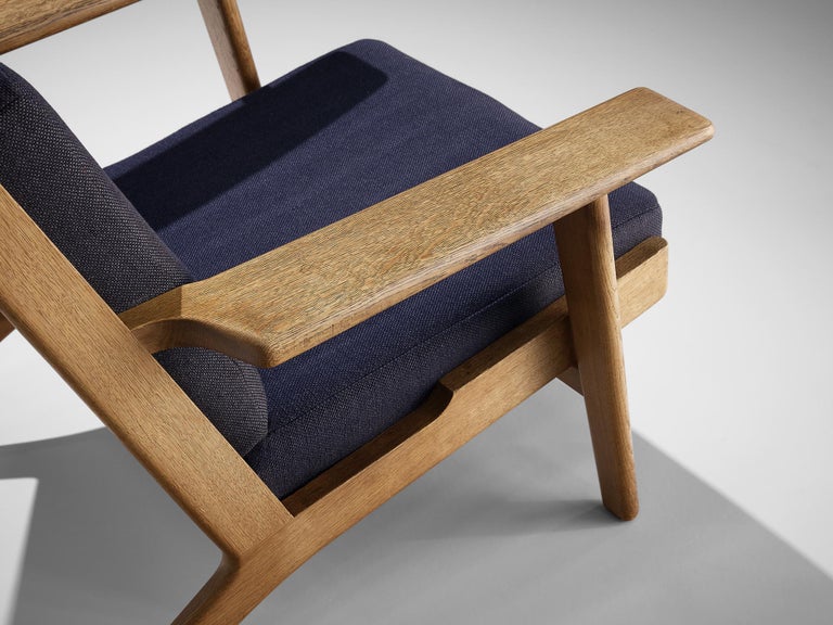 Hans J. Wegner for GETAMA Lounge Chair in Oak and Dark Blue Upholstery